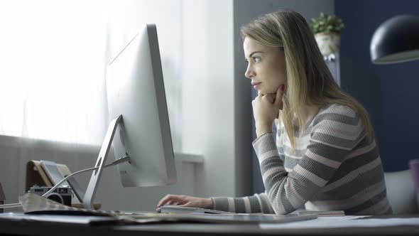 Young woman working with a computer in the office