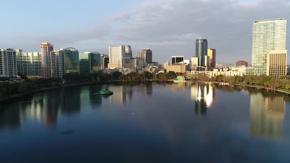 Aerial view of  buildings across Lake Eola Park alt