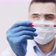 A Man Holding A Covid19 Positive Blood Sample Medical Stock Footage - VideoHive Item for Sale