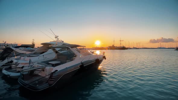View of the Ionian Sea port of Zakynthos at sunset, Greece. Port with multiple moored boats alt
