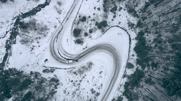 Overhead Top View Car Moving By Snowed Trail Road By Mountains Forest ...