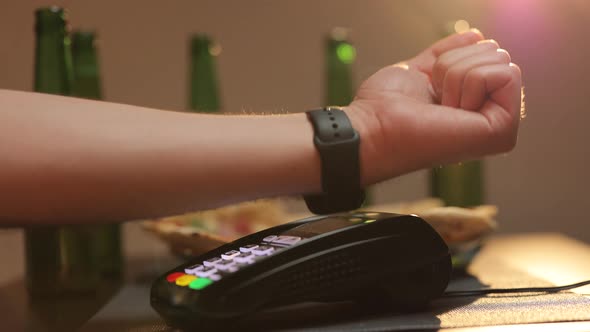 Man is Paying With a Smart Watch Online Shopping Using Modern Technology