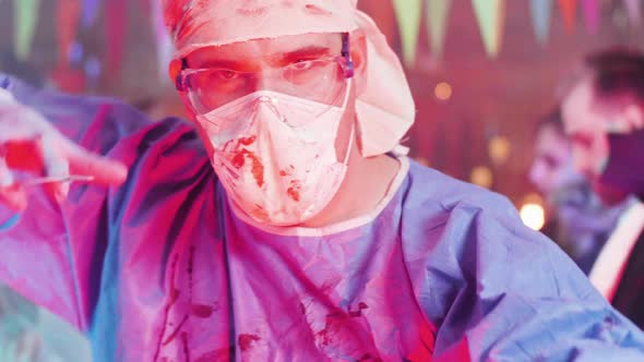 Crazy Physicist Turning To the Camera and Showing His Mad Face at a Halloween Party alt