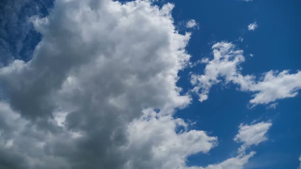 Clouds Move Smoothly in the Blue Sky. Timelapse alt