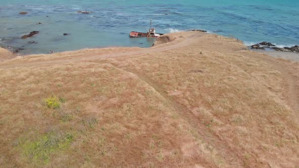 Ship Wreck in Ocean near Hiking Trails on Bluff