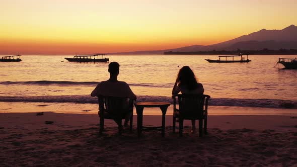 Beautiful people on honeymoon vacation have fun on beach on paradise white sand background 4K alt