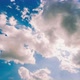 Timelapse blue sky with moving white clouds covering the sun - VideoHive Item for Sale