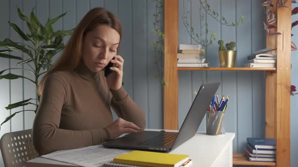 Businesswoman Sit at Desk Talk on Phone Provide Support To Client
