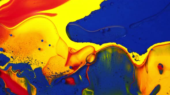 Bright Colorful Colors of Blue Red Yellow are Mixed and Swirls in Waves in Slow Motion Creating alt