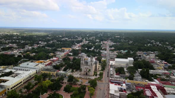 Aerial orbital view of sunset in valladolid main plaza in Yucatan Mexico alt