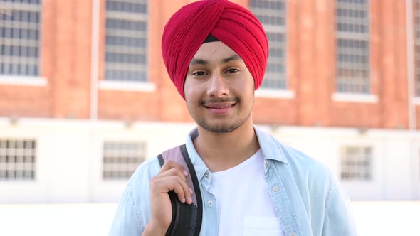 Inspired Indian Male Student in Traditional Turban with Backpack Outdoors