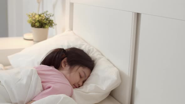 Asia japanese woman child kid relax rest asleep lying on bed., Stock Footage