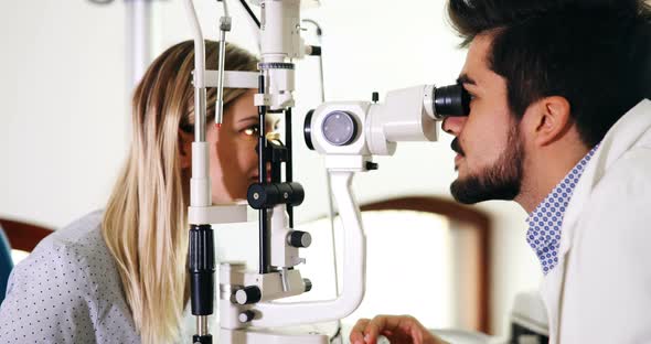 Optometrist Checking Patient Eyesight and Vision Correction