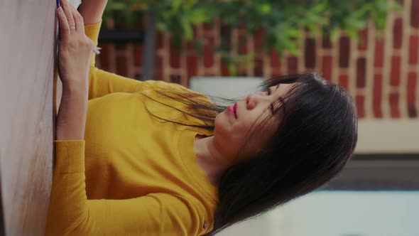 Vertical Video Portrait of Person Analyzing Company Paperwork for Innovation alt