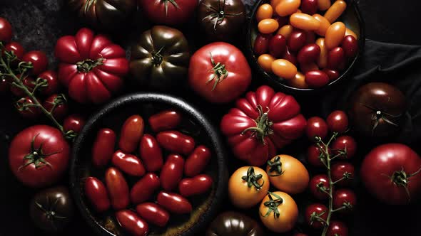 Various Kinds of Tomatoes Placed on Dark Rusty Table