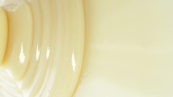 White Yogurt Sauce Milk Caramel Texture Close Up Abstract Beige Cream Motion alt