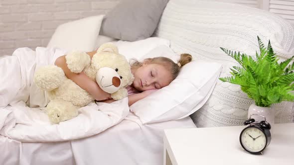 Cute Little Child Girl Sleeping with Teddy Bear