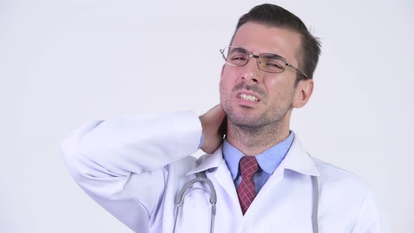 Young Stressed Hispanic Man Doctor Having Neck Pain alt