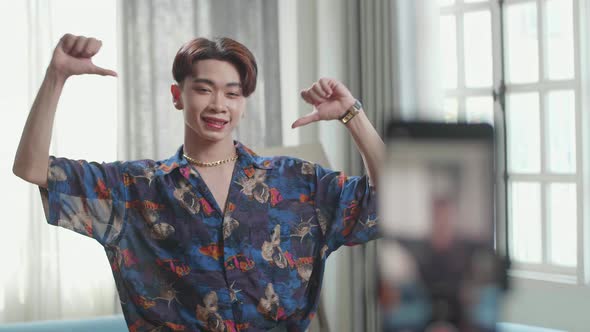 Asian Transgender Male Dancing While Shooting Video Content For Social Networks With A Smartphone alt