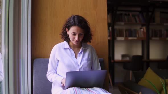 Businesswoman or Student Working on Laptop at Library or Workplace alt