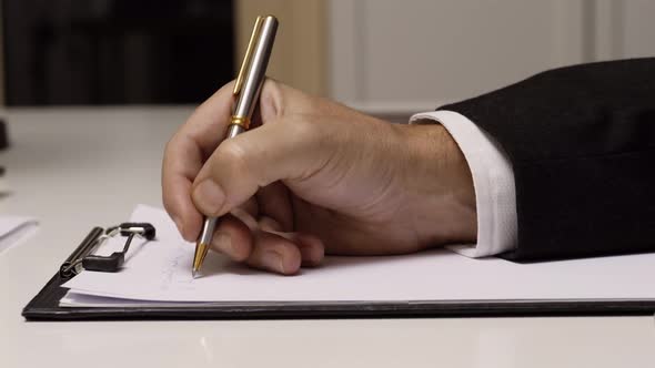 Businessman Writing on White Paper