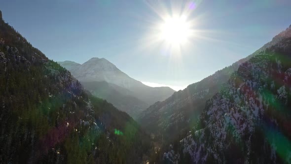 Flying over American Fork Canyon viewing the layers of the mountains alt