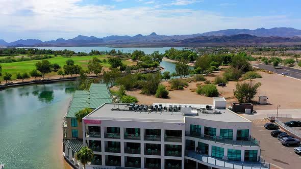 Aerial view and panning down looking at the Heat Hotel in Lake Havasu City, Arizona. alt