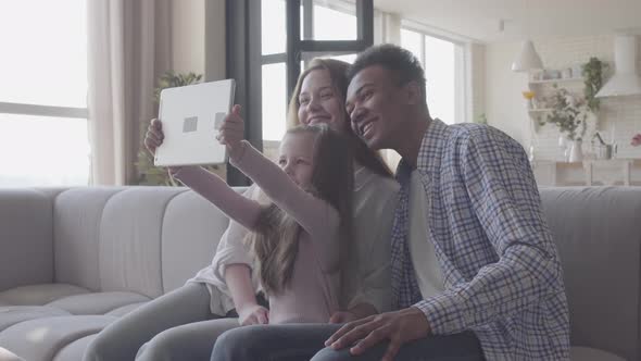 Beautiful Young International Family at Home, African American Man, Caucasian Woman and Small Girl alt