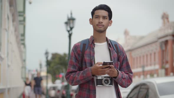 Young Asian man blogger happy enjoying leisure lifestyle travel.