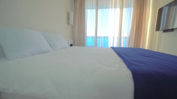 New apartments in hotel. camera flies all over room, living room with a bed alt