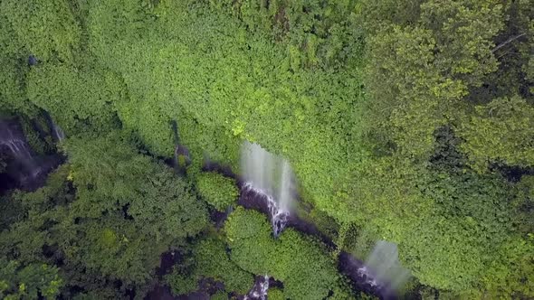 Triple waterfall in the mountain jungle.Beautiful aerial view flight bird's eye view drone footage alt