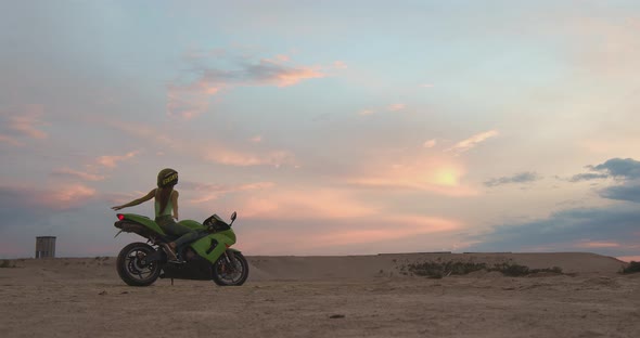 Cool Woman in Helmet on Motorbike on Beach