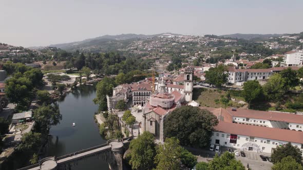 Igreja de Sao Goncalo against picturesque Amarante city, Minho, Portugal. Orbiting shot alt
