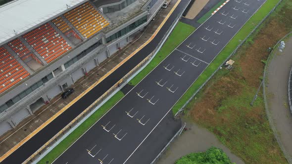 Aerial pan shot over the sport car circuits track in china alt