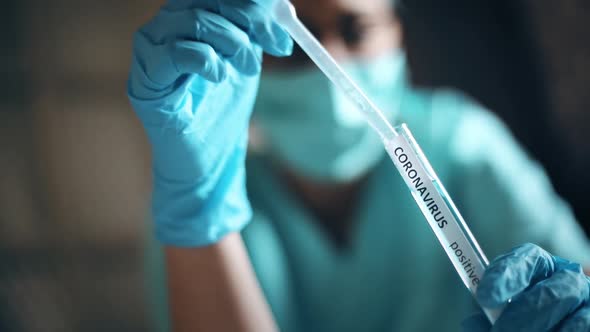 Doctor taking samples from coronavirus COVID-19 test tube