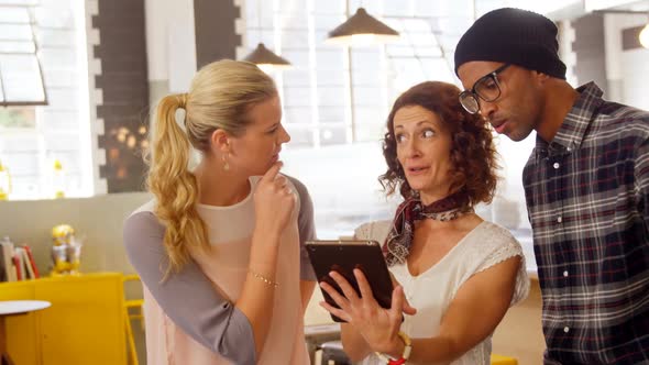 Executives using digital tablet 4k alt