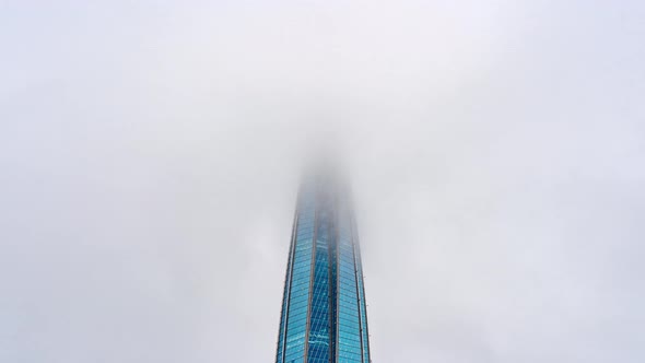 The Spire of Skyscraper in Low Clouds