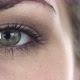 Green Eye of a Girl Opened Slowly the Pupil Reacts to Light - VideoHive Item for Sale