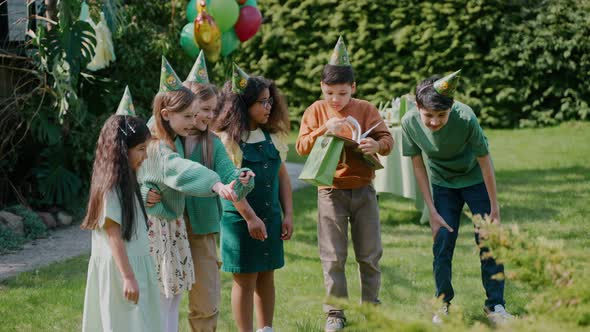 Children Having Fun at a Backyard Birthday Party on a Sunny Day