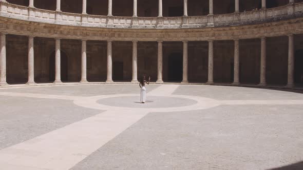 Glamorous Tourist In Alhambra Palace Courtyard alt
