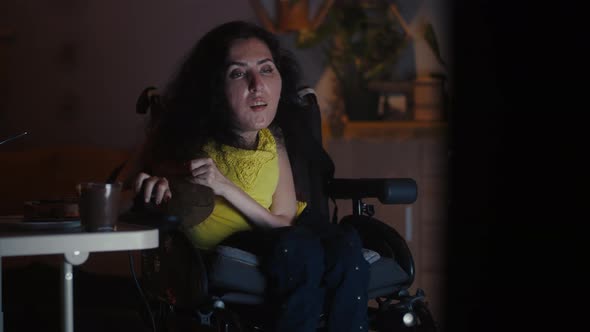 Woman Relaxing Near TV in the Evening alt