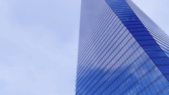 Blue Sky And White Clouds Reflecting In A Glass Building Time-Lapse