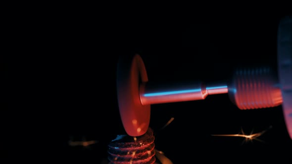 Close-up of Worker Grinds Down Metal with a Grinder at Construction Plant. Industrial Production alt
