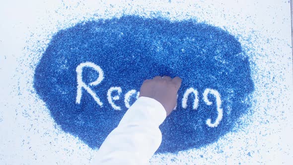 Indian Hand Writes On Blue Reading