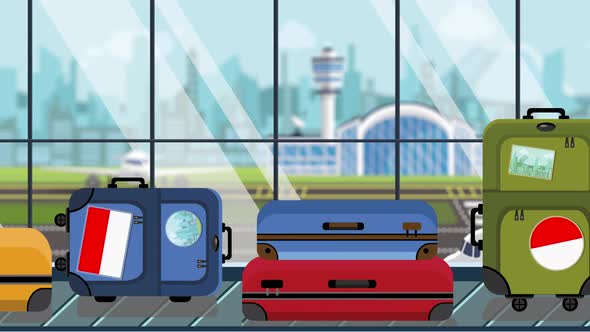 Luggage with Indonesian Flag Stickers on Baggage Carousel alt