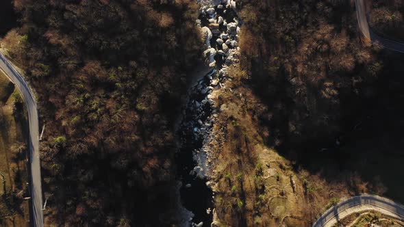 Aerial View Mountain Landscape River Crossing Mountain Curved Road Overpass the River alt