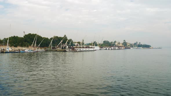 Bank of the Nile River with Ships Sailboats and Yachts alt