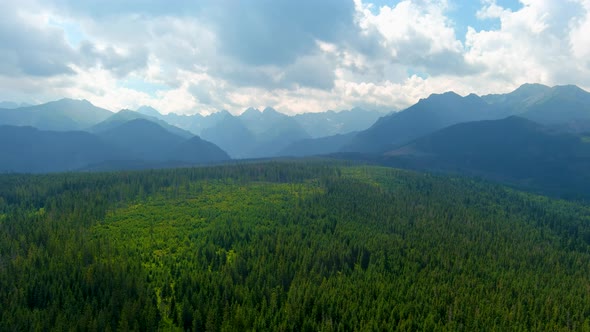 Aerial view of the cloudy Tatras mountain range near the town of Zakopane alt