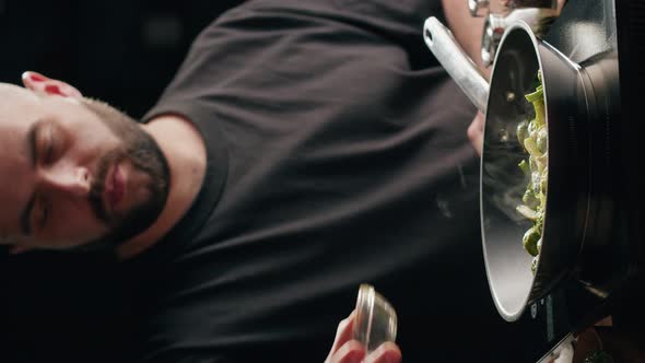 Vertical Video of Chef Frying Green Brussels Sprouts Cabbage in Pan Closeup alt