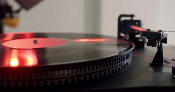 Hand Turns on a Vintage Vinyl Record and Vinyl Record is Spinning alt